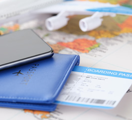 Passport, boarding pass and travel documents laid out for a work visa application